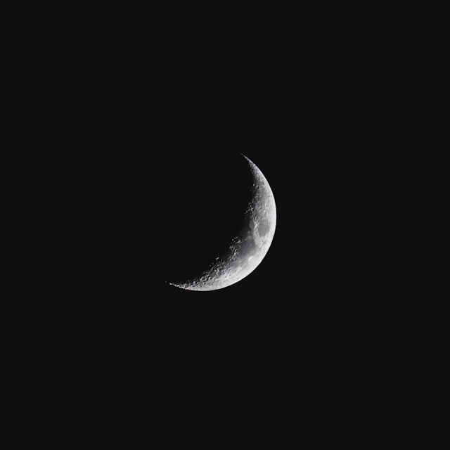 Dark Sky with just a crescent moon and no stars